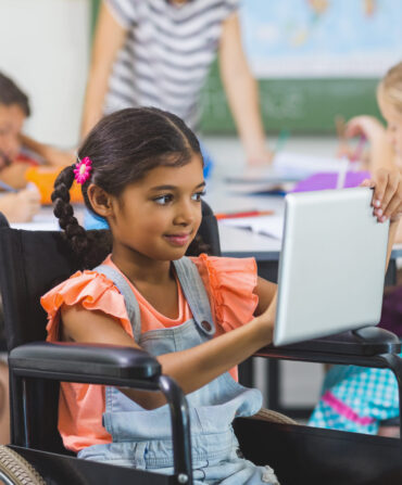 disabled-schoolgirl-using-digital-tablet-in-classr-2025-10-28-21-50-04-utc